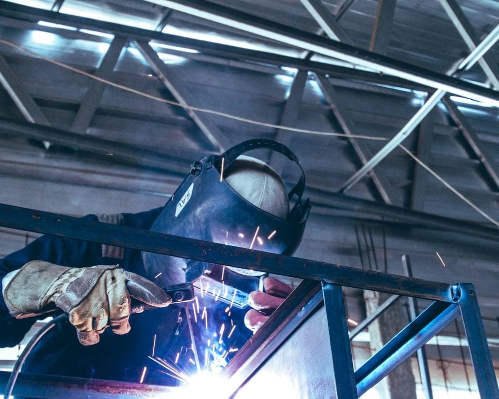 Workshop welding with protective gear and sparks